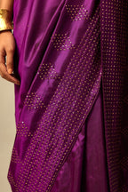 Plum purple silk saree set with a broad sequin border with diamond motifs.