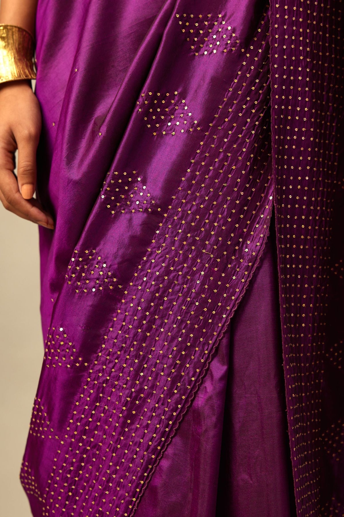 Plum purple silk saree set with a broad sequin border with diamond motifs.