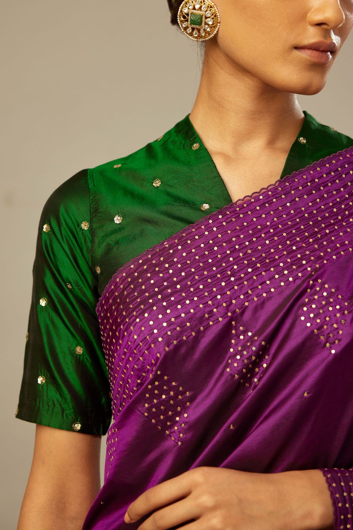 Dark green silk easy fit blouse with a raised V neck and all-over delicate hand embroidered sequins flowers.