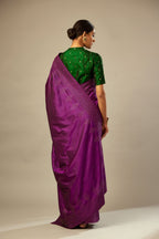 Plum purple silk saree set with a broad sequin border with diamond motifs.