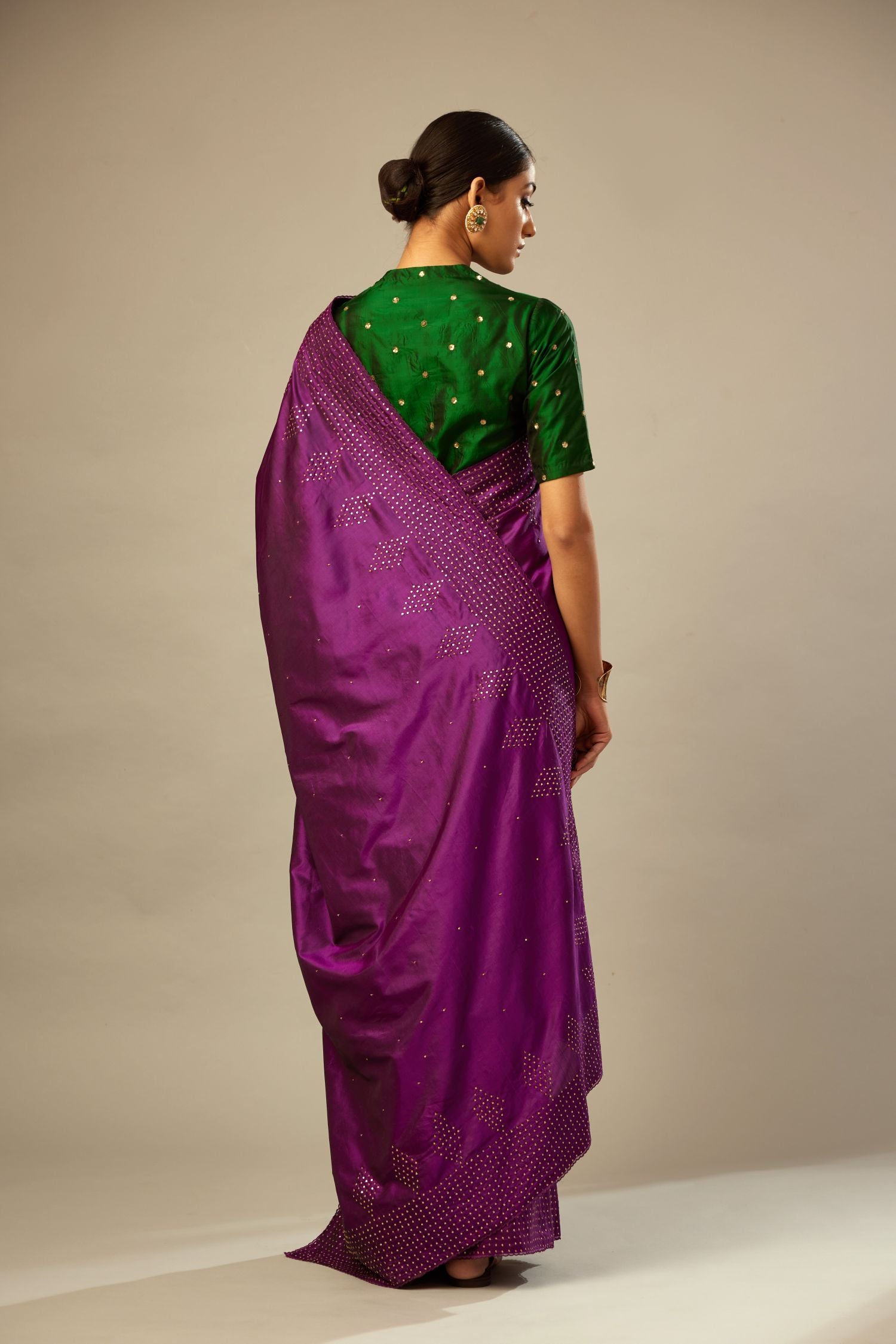 Dark green silk easy fit blouse with a raised V neck and all-over delicate hand embroidered sequins flowers.