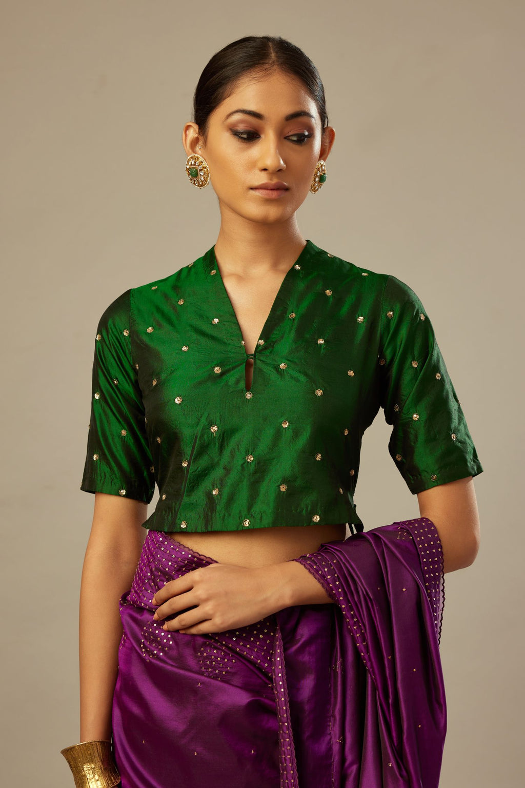 Dark green silk easy fit blouse with a raised V neck and all-over delicate hand embroidered sequins flowers.