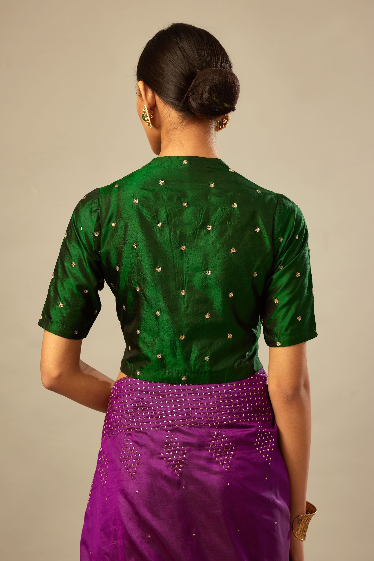 Dark green silk easy fit blouse with a raised V neck and all-over delicate hand embroidered sequins flowers.