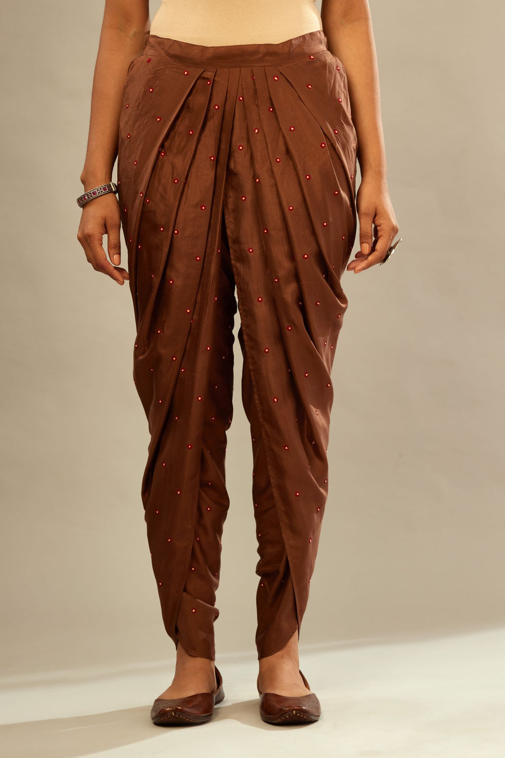 Brown silk dhoti with all over small flower embroidery.