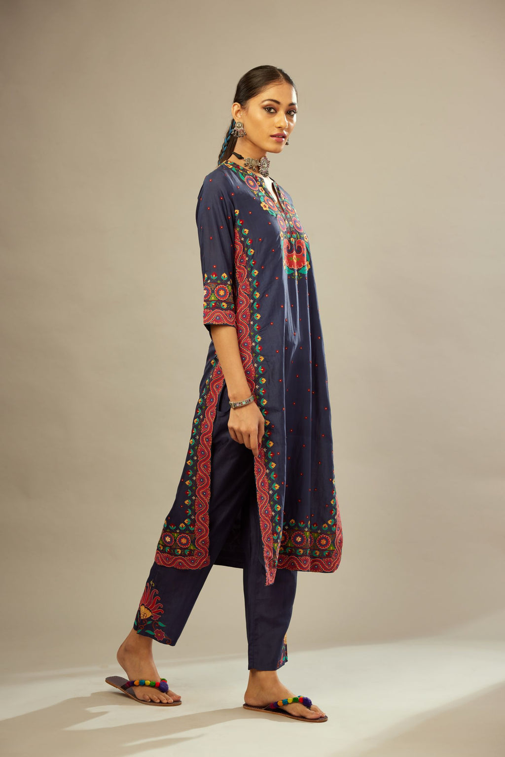 Indigo slim fit straight kurta set, decorated with bold appliqué borders all along the side seam, hem and sleeve cuffs.