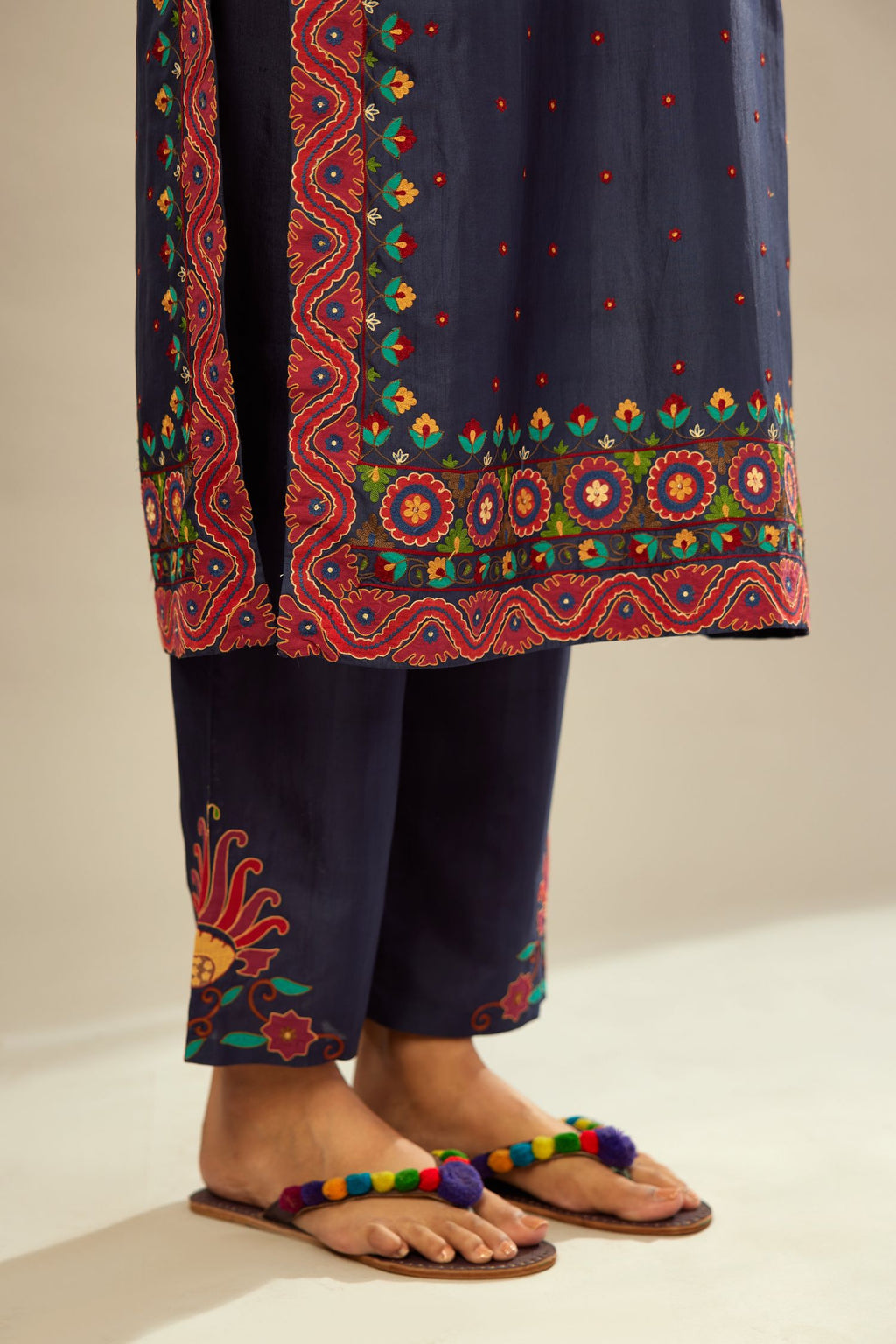 Indigo slim fit straight kurta set, decorated with bold appliqué borders all along the side seam, hem and sleeve cuffs.