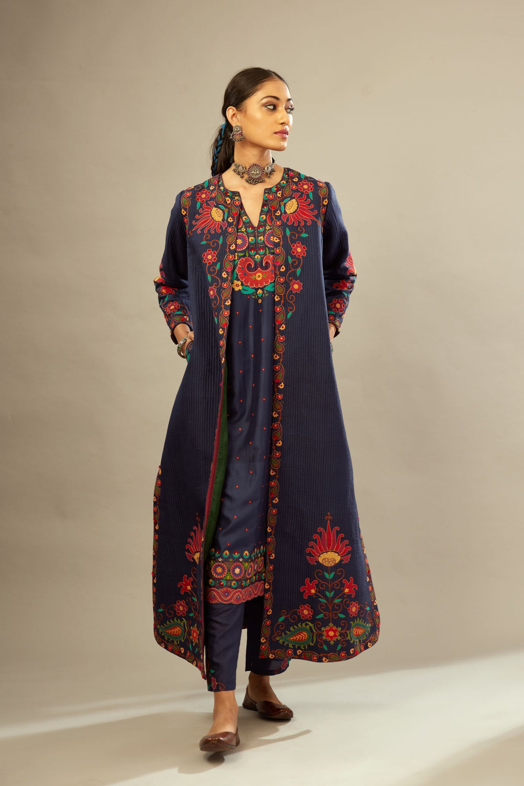 Indigo quilted ankle length front open silk jacket with bold multi-colored appliqué flower trellises.