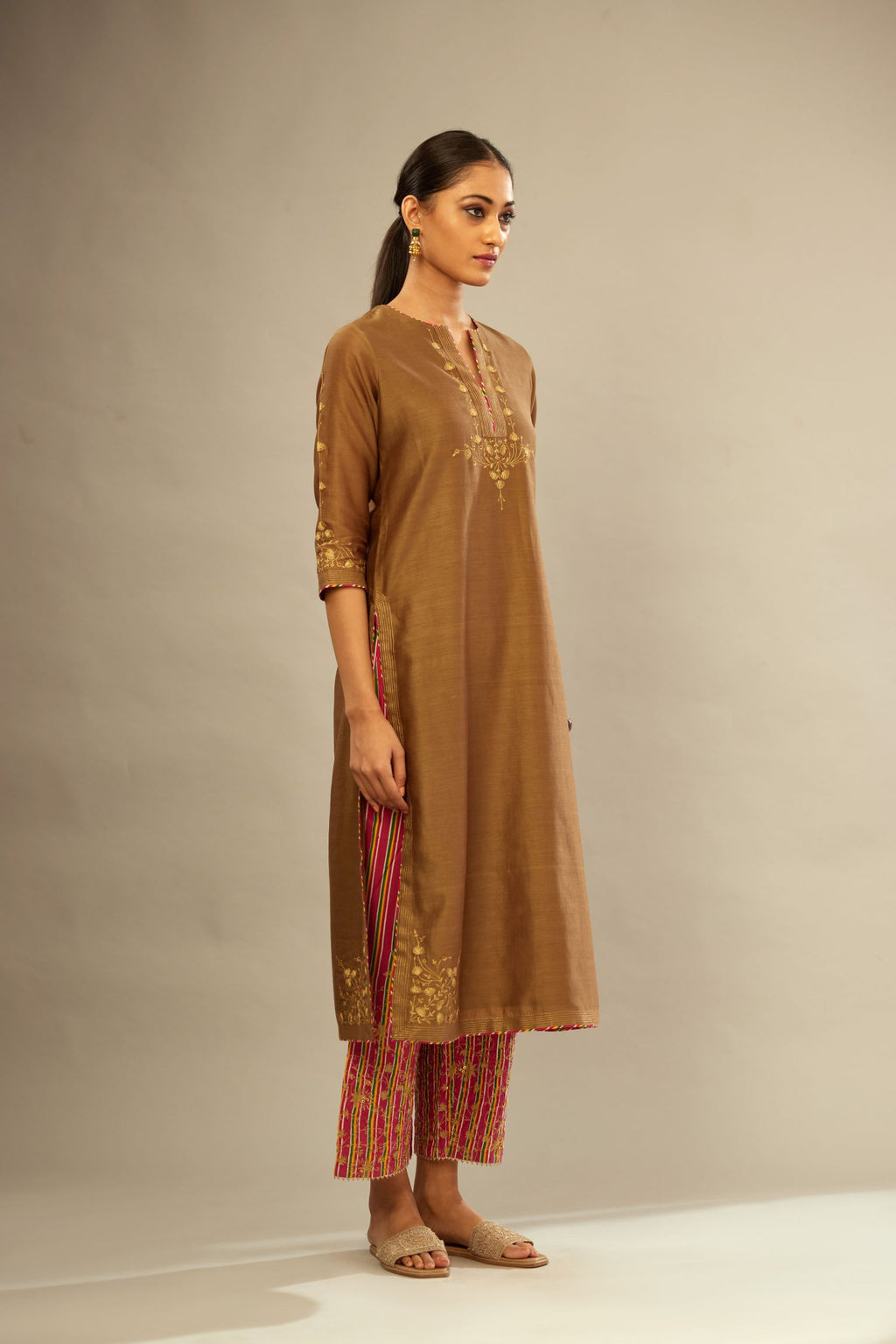 Olive silk Chanderi kurta set with zari embroidery, highlighted with golden zari quilting