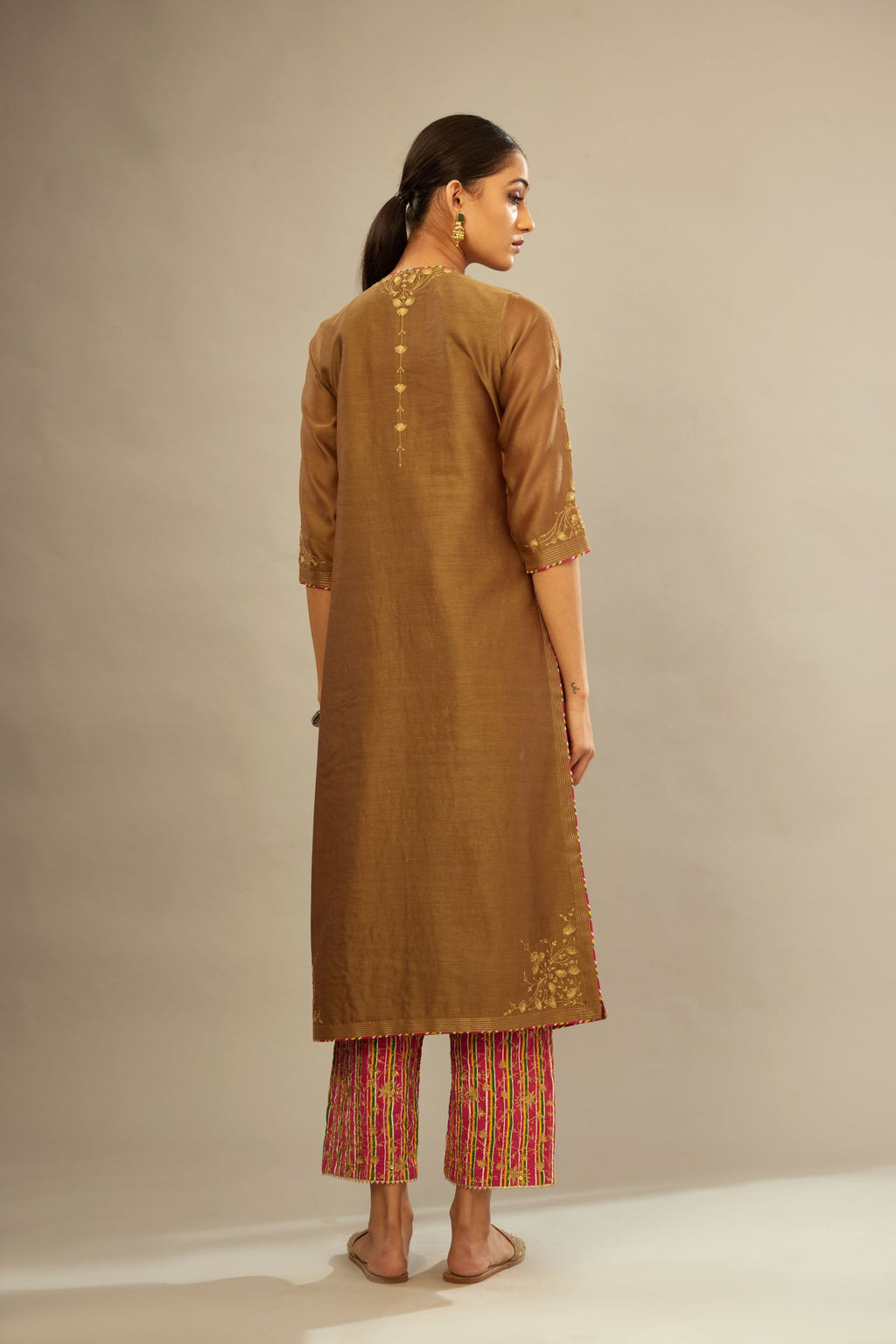 Olive silk Chanderi kurta set with zari embroidery, highlighted with golden zari quilting