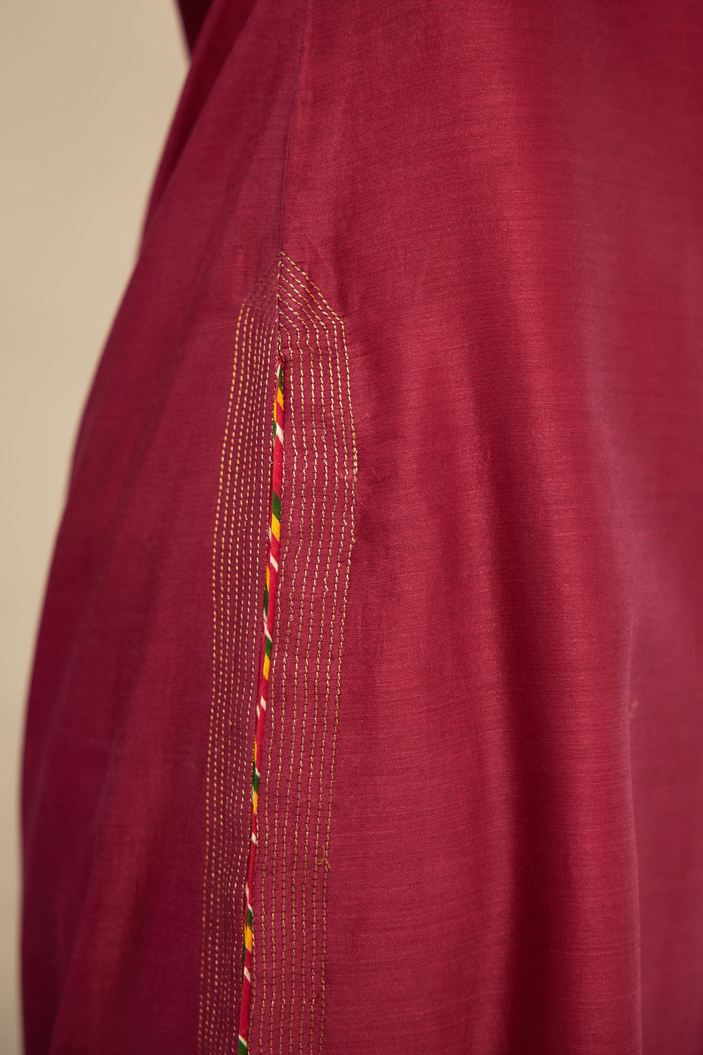 Deep wine silk Chanderi kurta set with zari embroidery, highlighted with goldenr zari quilting