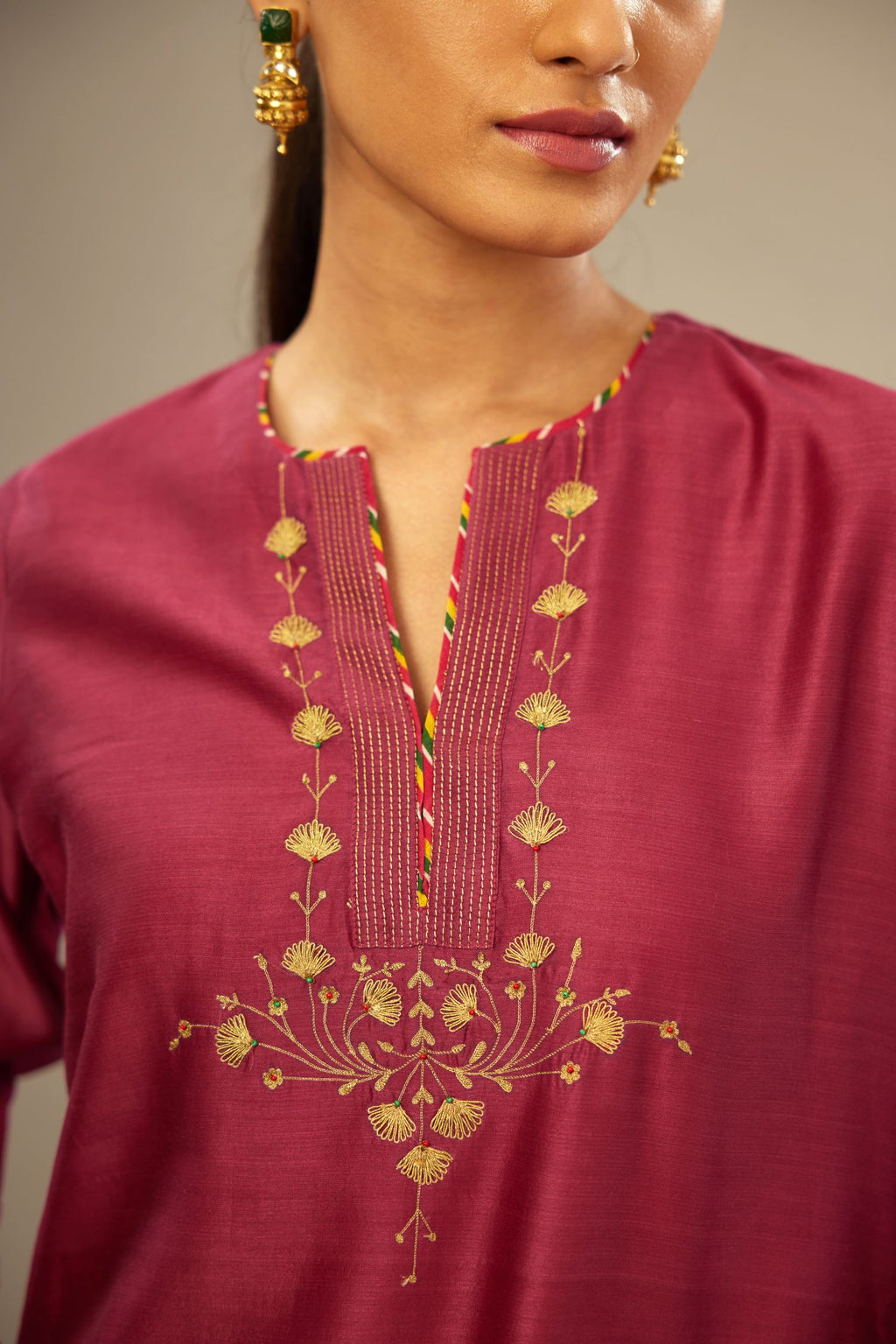 Deep wine silk Chanderi kurta set with zari embroidery, highlighted with goldenr zari quilting