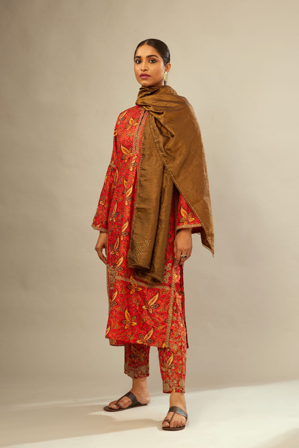 Burnt orange digital printed dori embroidered silk kurta set, highlighted with gold sequin handwork.