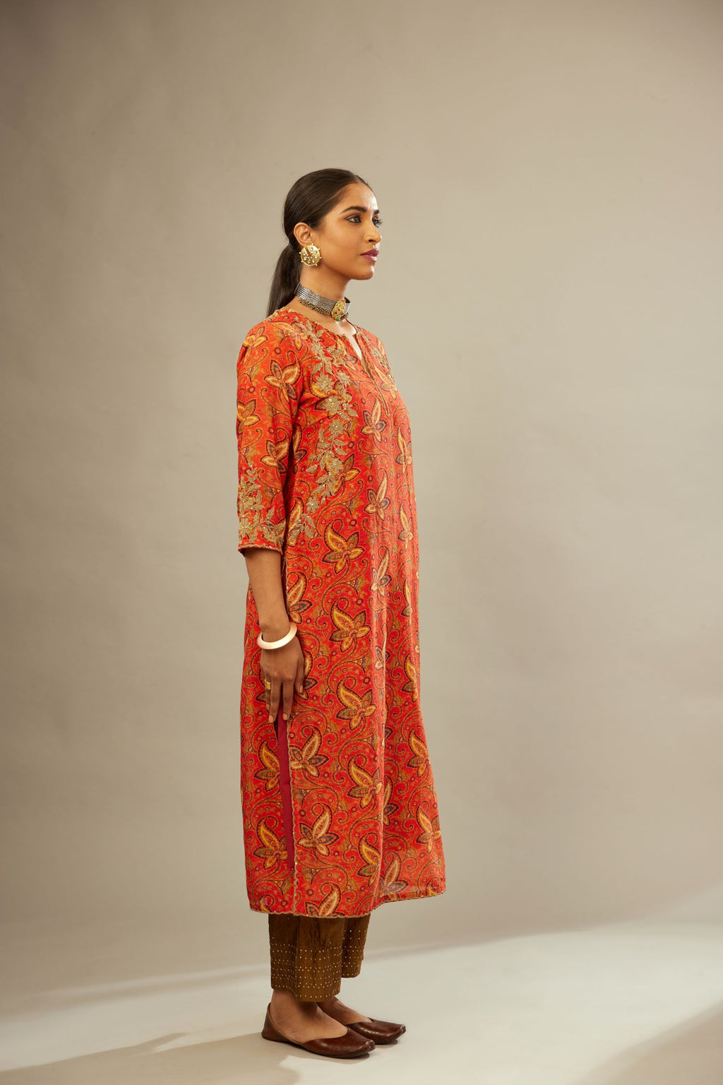 Burnt orange digital printed silk straight kurta set, highlighted with gold dori embroidery, highlighted with gold sequin hand work.