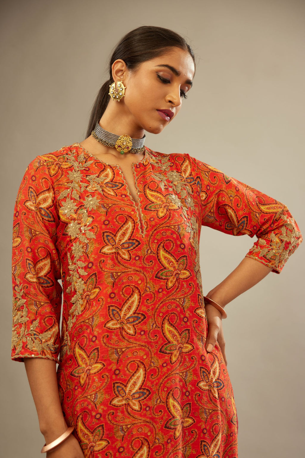 Burnt orange digital printed silk straight kurta set, highlighted with gold dori embroidery, highlighted with gold sequin hand work.