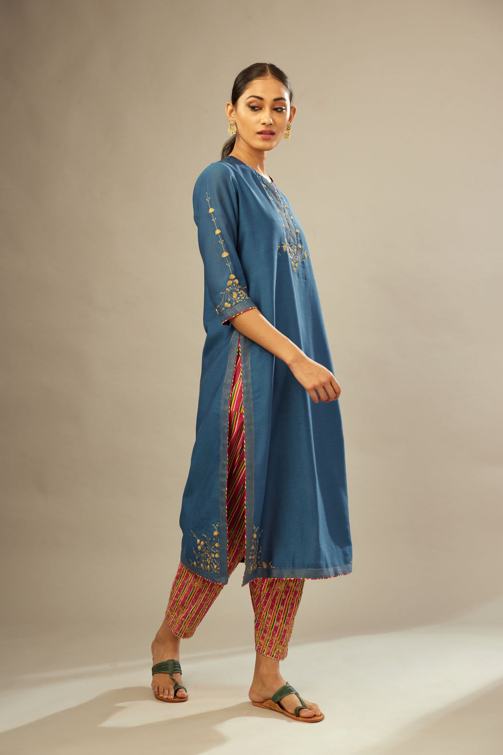 Teal blue silk Chanderi kurta set with zari embroidery, highlighted with golden zari quilting