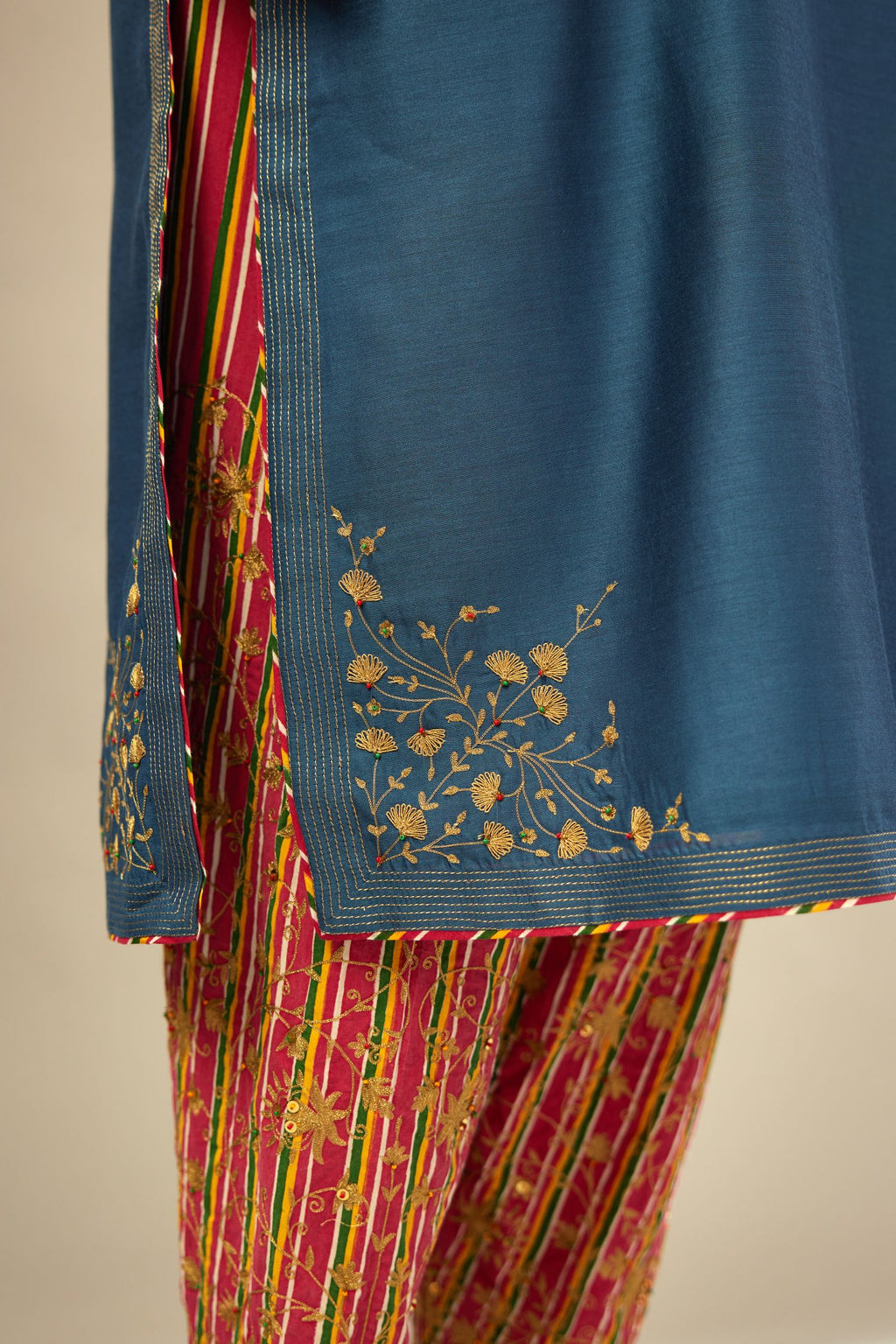 Teal blue silk Chanderi kurta set with zari embroidery, highlighted with golden zari quilting