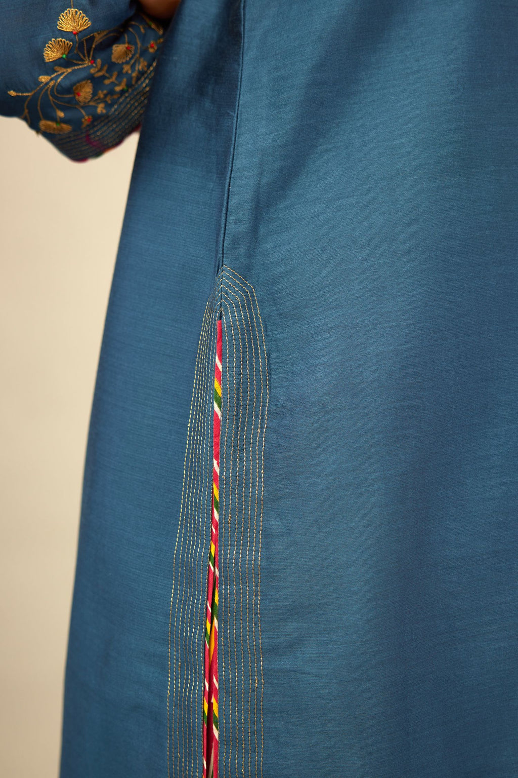 Teal blue silk Chanderi kurta set with zari embroidery, highlighted with golden zari quilting