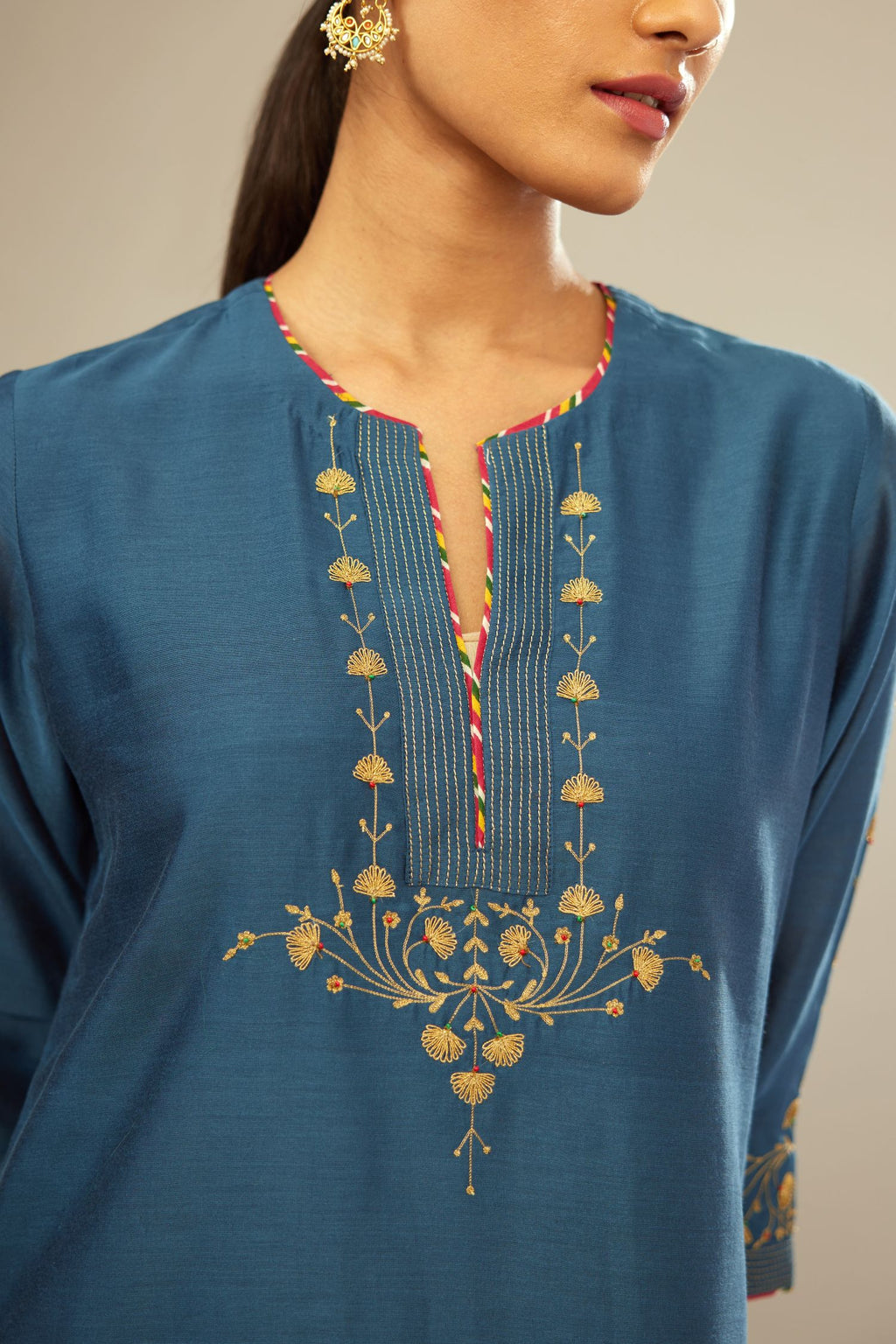 Teal blue silk Chanderi kurta set with zari embroidery, highlighted with golden zari quilting