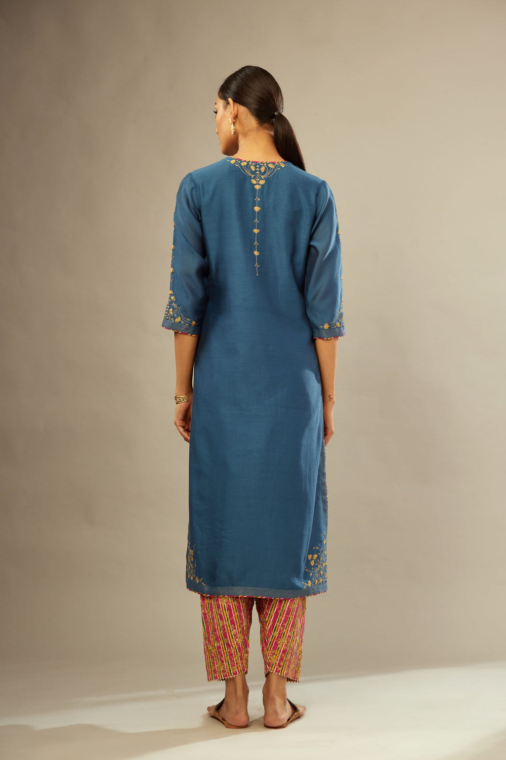 Teal blue silk Chanderi kurta set with zari embroidery, highlighted with golden zari quilting