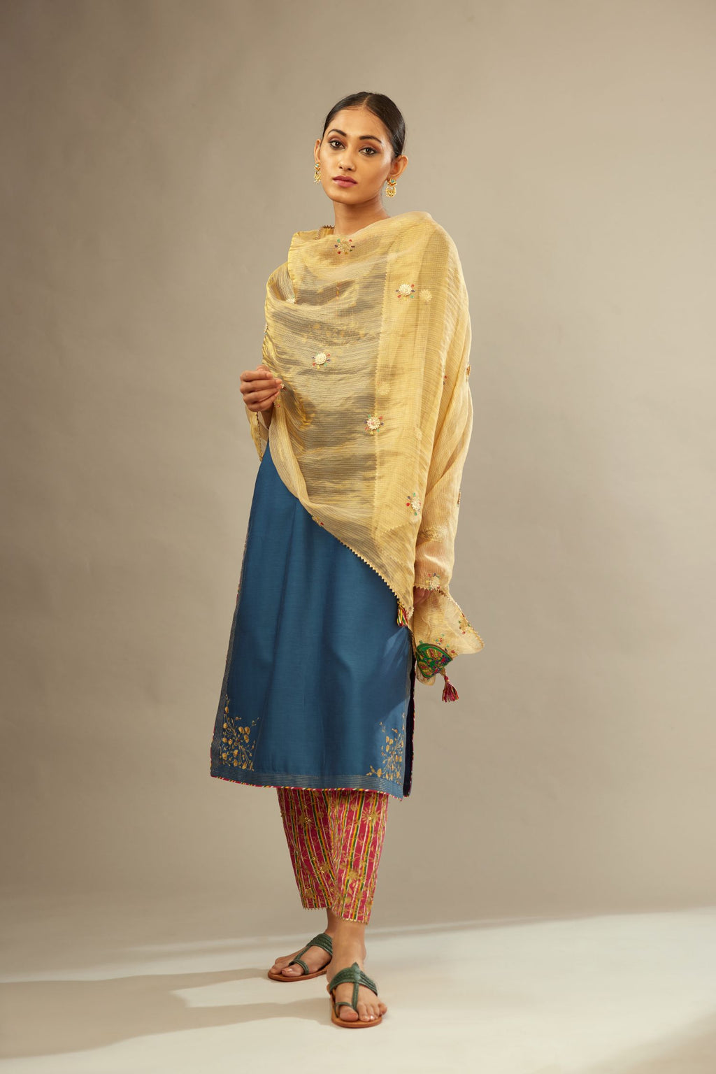 Teal blue silk Chanderi kurta set with zari embroidery, highlighted with golden zari quilting