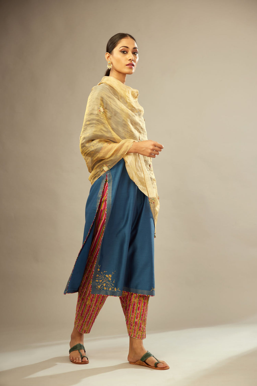 Teal blue silk Chanderi kurta set with zari embroidery, highlighted with golden zari quilting
