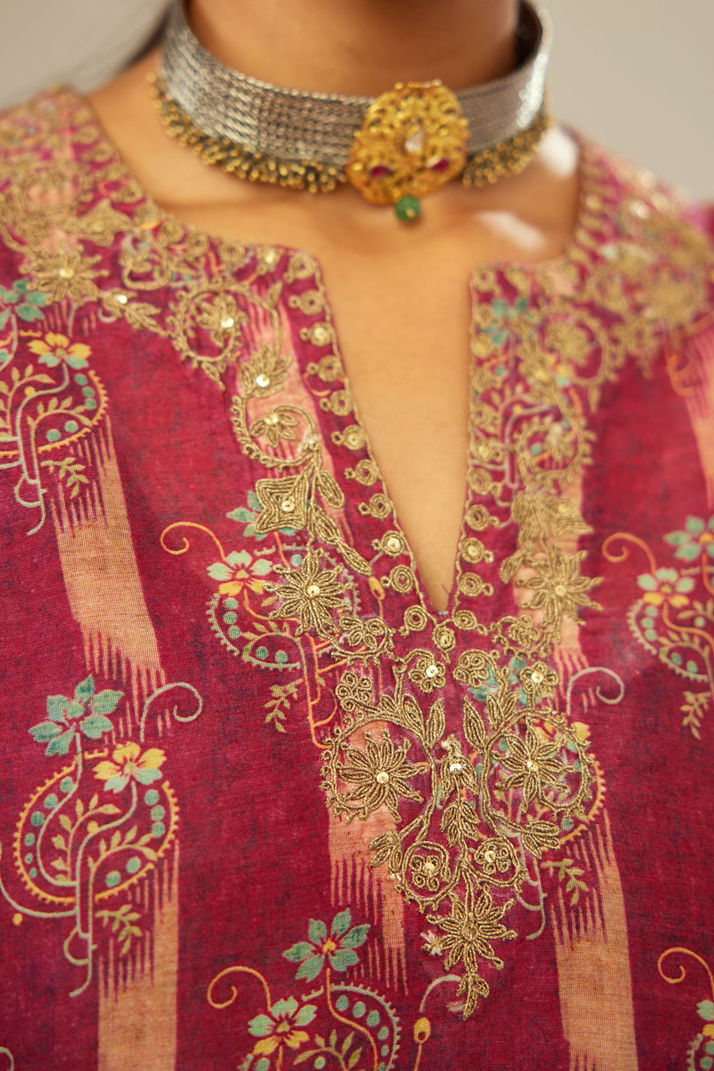 Deep wine digital printed dori embroidered fine silk short kurta set, highlighted with gold sequin hand work. Paired with silk velvet jacket.