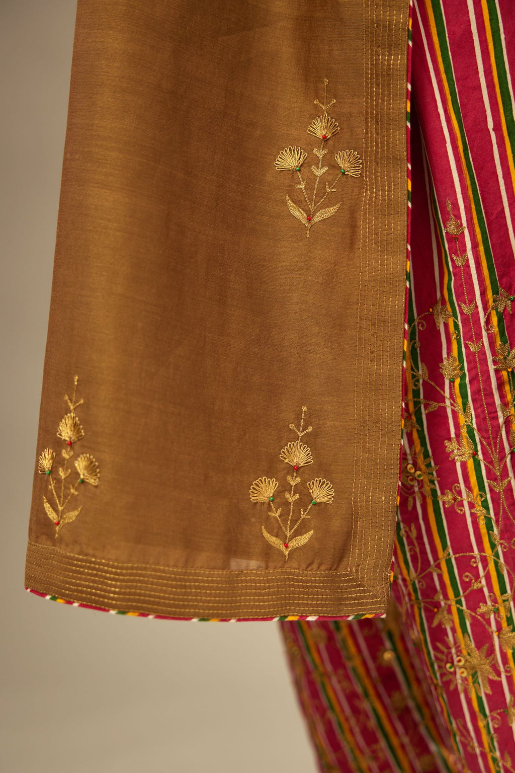 Olive silk chanderi kurta set with golden zari embroidery bootas all over the kurtaand quilted edges.