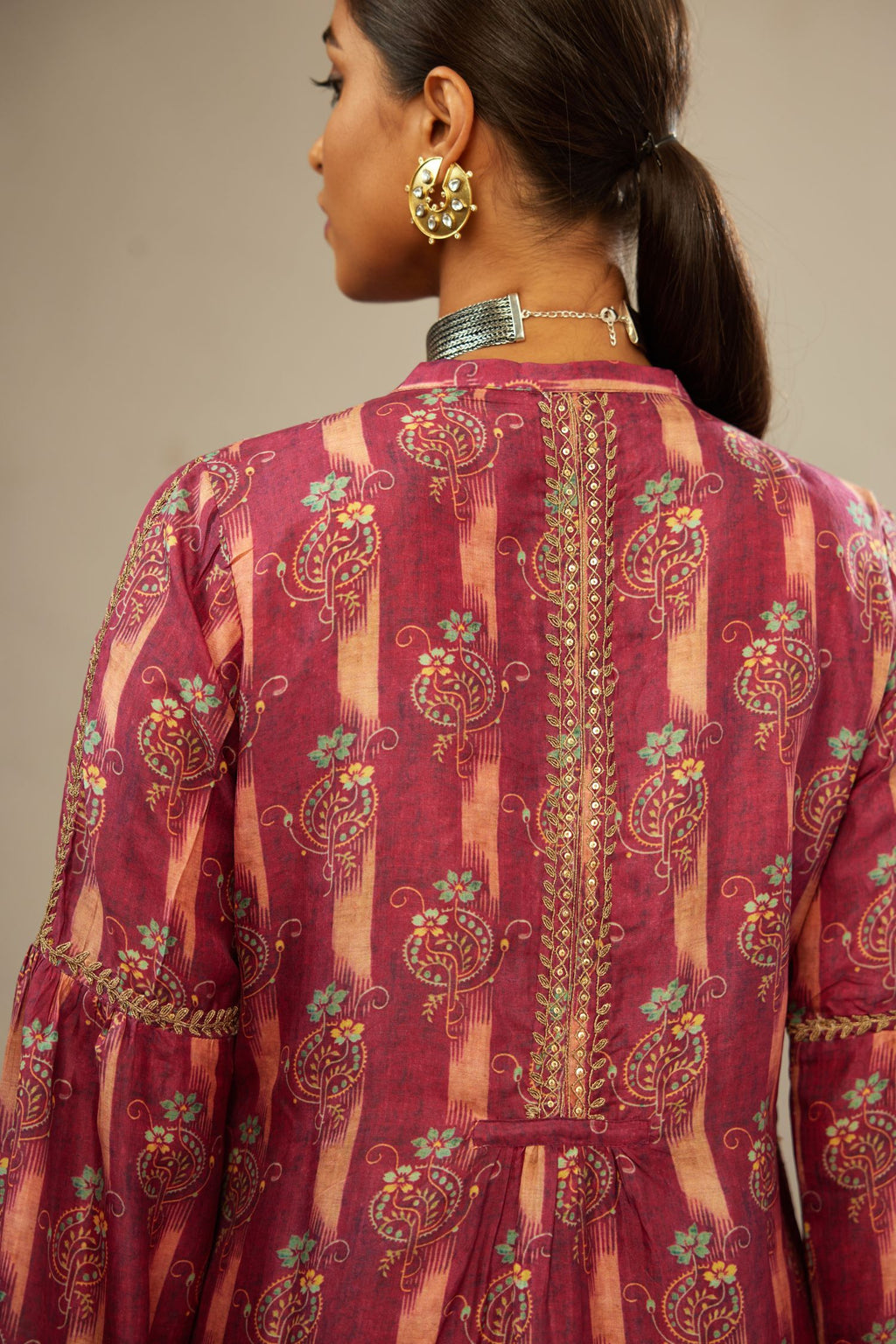 Deep wine orange digital printed dori embroidered silk kurta set, highlighted with gold sequin handwork.