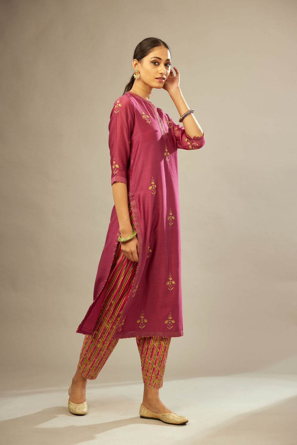 Deep wine silk chanderi kurta set with golden zari embroidery bootas all over the kurta and quilted edges.