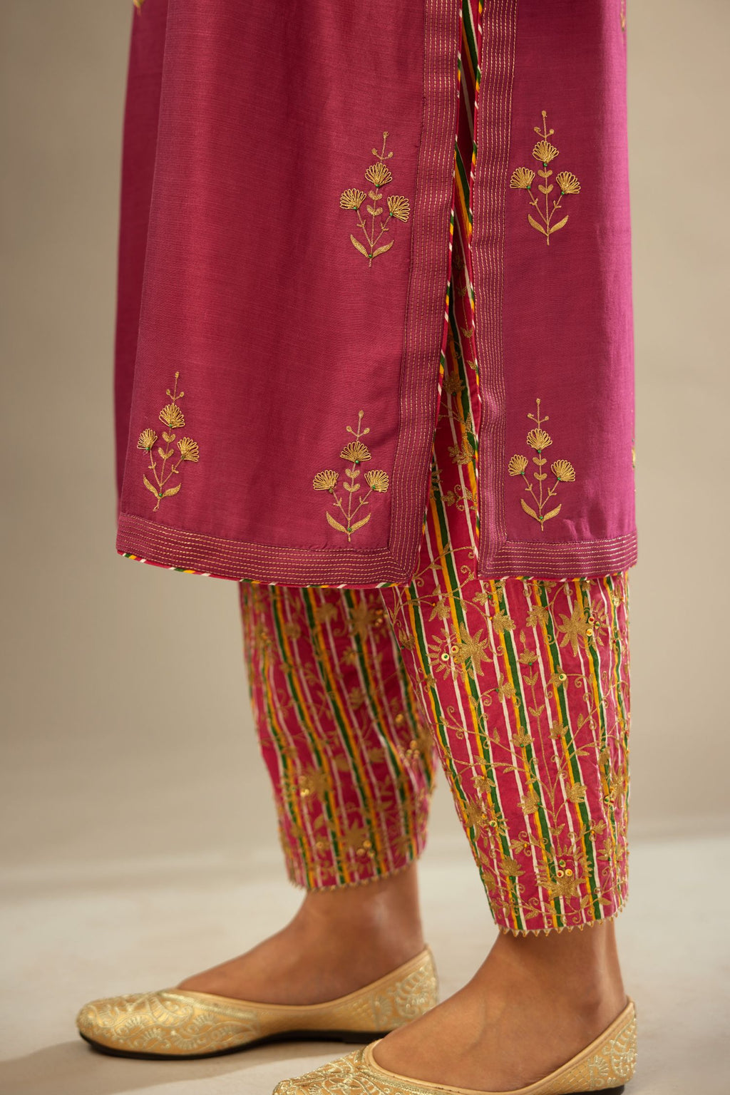 Deep wine silk chanderi kurta set with golden zari embroidery bootas all over the kurta and quilted edges.