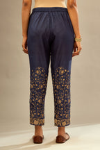 Navy blue fine silk straight pants with heavy golden zari and dori embroidery at bottom.