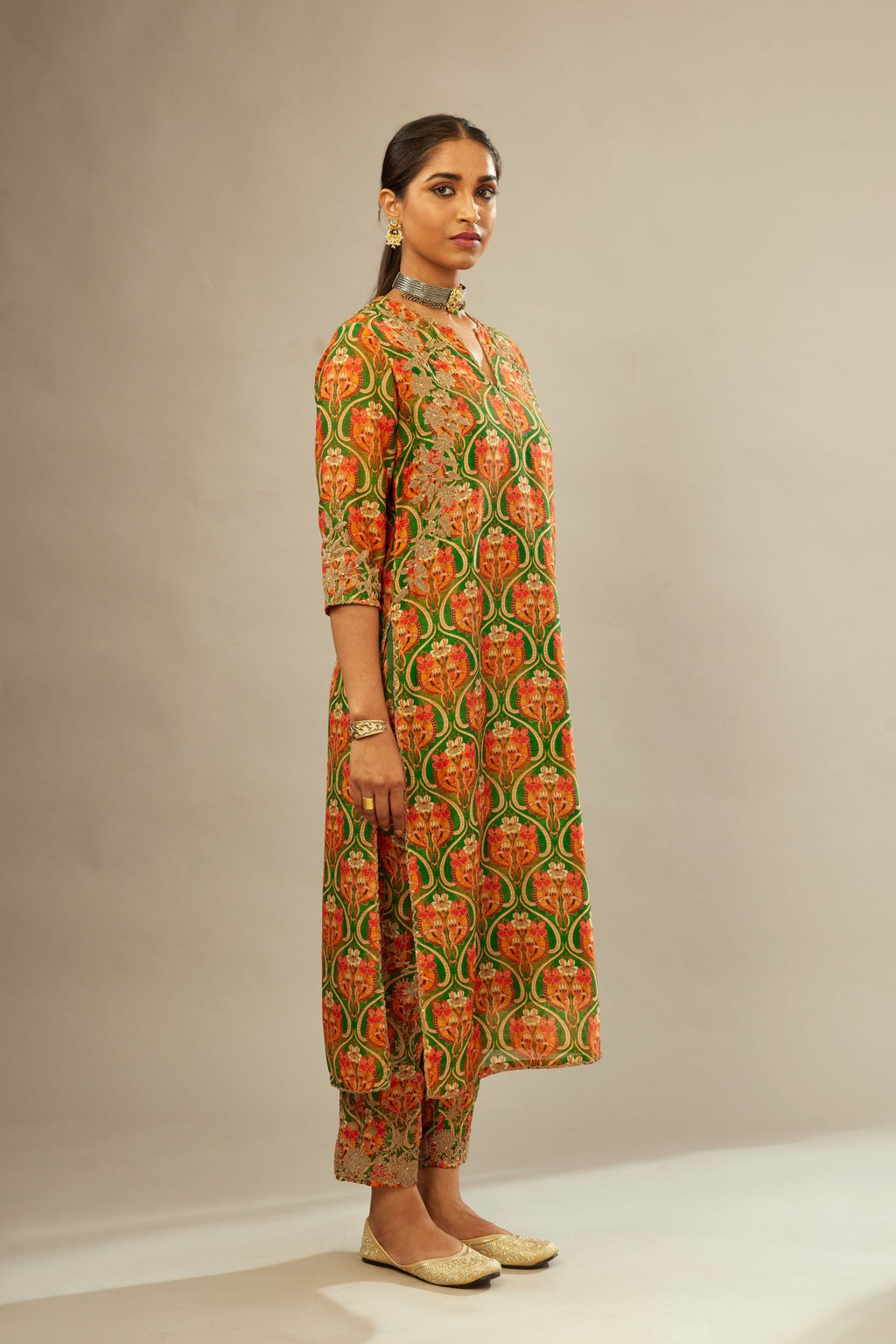 Green and orange digital printed silk straight kurta set, highlighted with gold dori embroidery, highlighted with gold sequin hand work.
