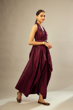 Wine silk long free size dress with asymmetric hem and side pockets, paired with navy blue silk velvet short jacket with light gold dori embroidery all-over the jacket.
