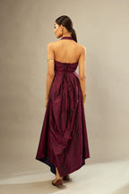 Wine silk long free size dress with asymmetric hem and side pockets, paired with navy blue silk velvet short jacket with light gold dori embroidery all-over the jacket.