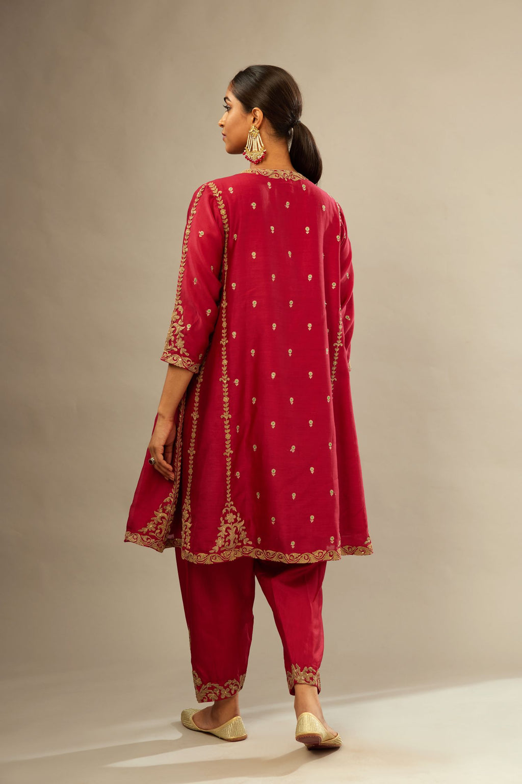 Fuchsia silk chanderi short kalidar kurta set with all-over delicate zari bootis, detailed with dori embroidery and gold sequin work.