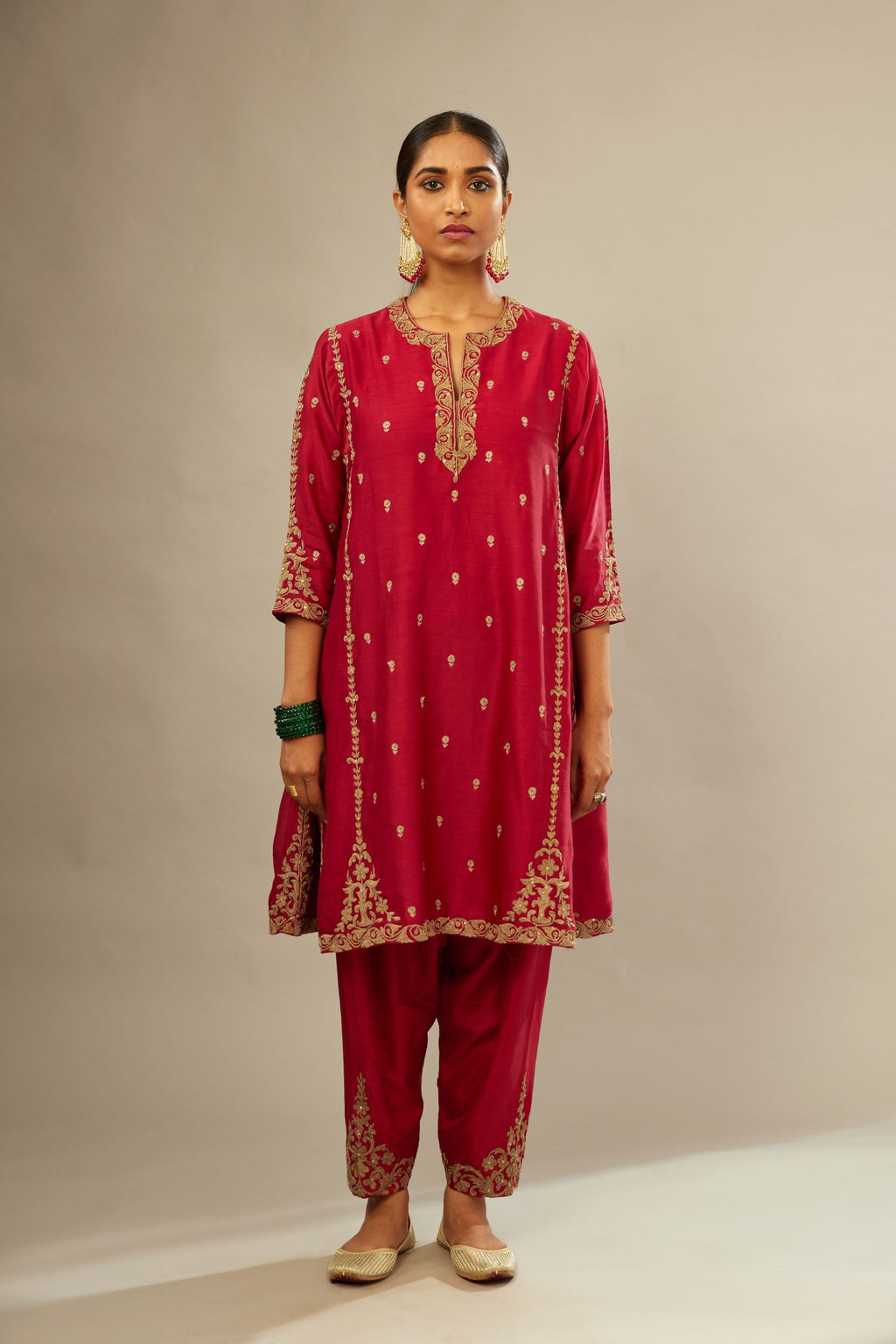 Fuchsia silk chanderi short kalidar kurta set with all-over delicate zari bootis, detailed with dori embroidery and gold sequin work.