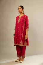 Fuchsia silk chanderi short kalidar kurta set with all-over delicate zari bootis, detailed with dori embroidery and gold sequin work.