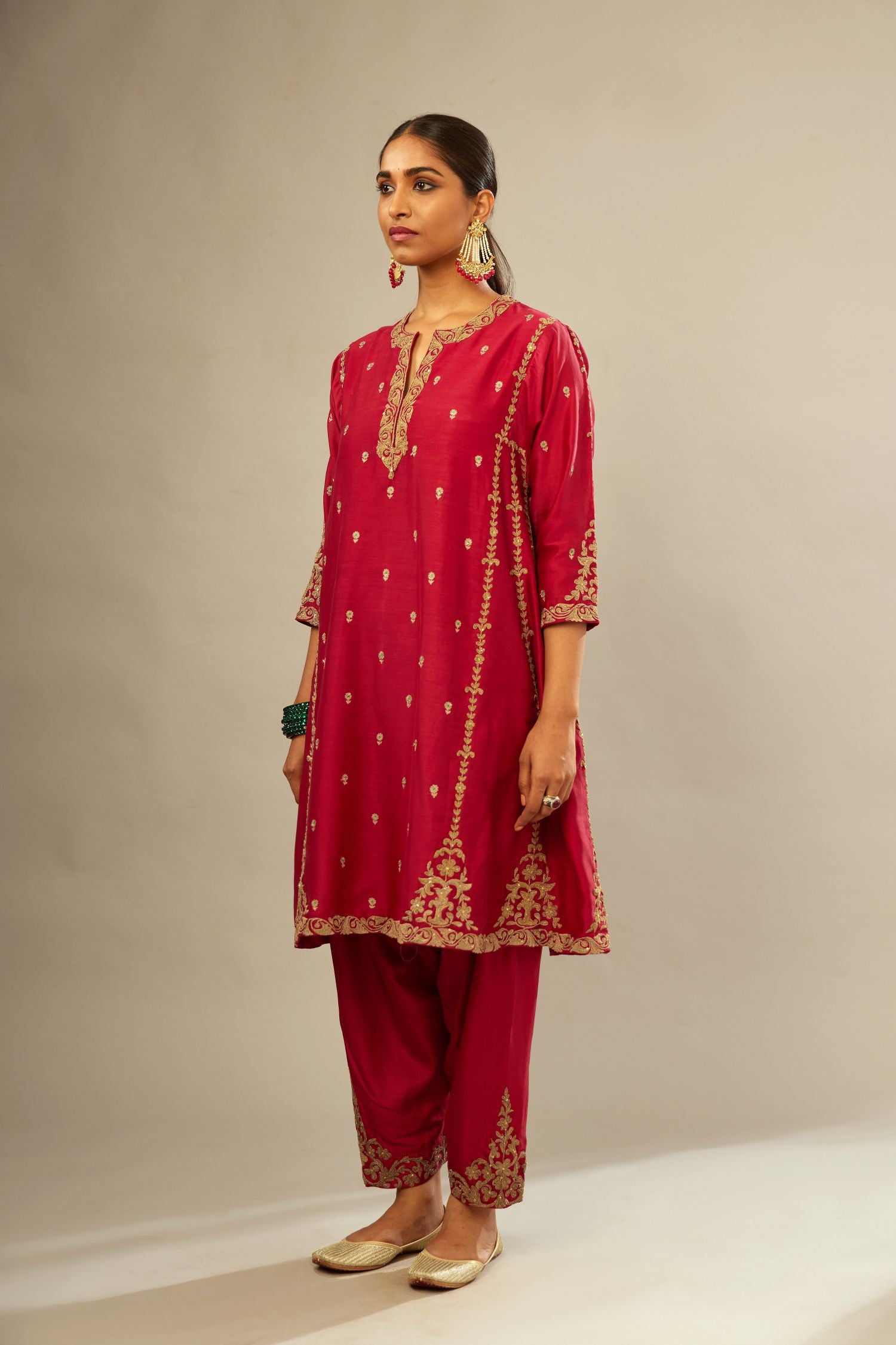 Fuchsia silk chanderi short kalidar kurta set with all-over delicate zari bootis, detailed with dori embroidery and gold sequin work.