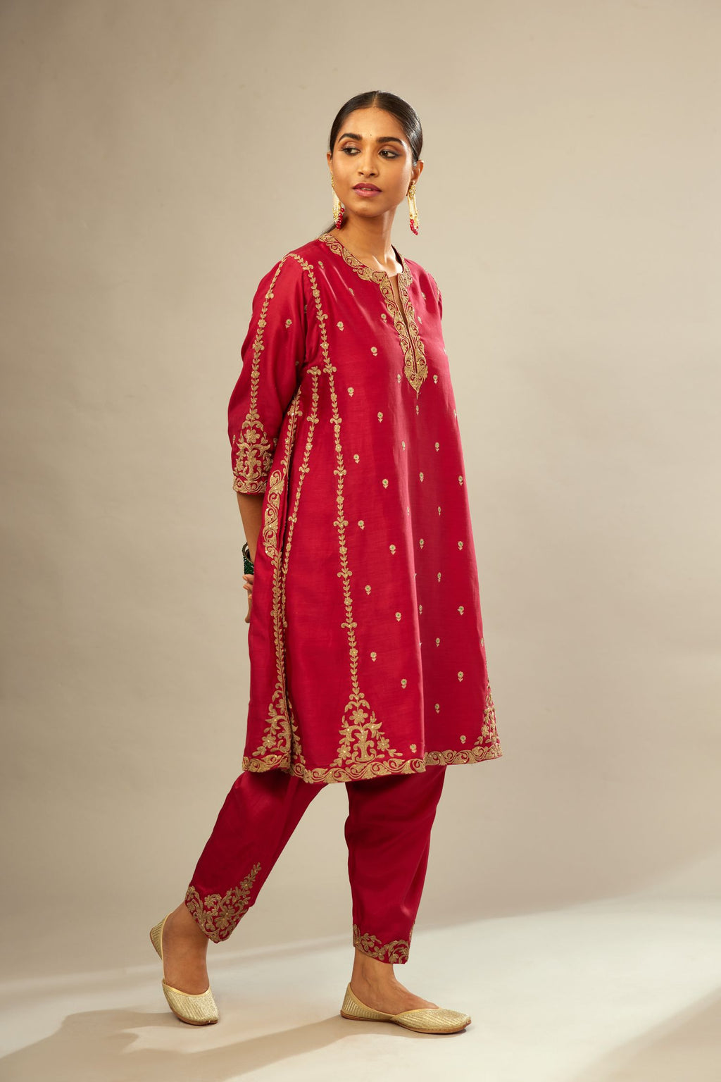 Fuchsia silk chanderi short kalidar kurta set with all-over delicate zari bootis, detailed with dori embroidery and gold sequin work.