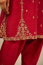 Fuchsia silk chanderi short kalidar kurta set with all-over delicate zari bootis, detailed with dori embroidery and gold sequin work.