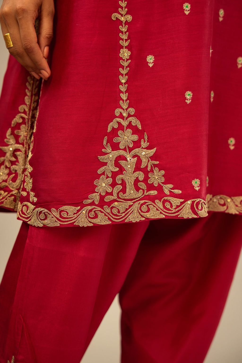 Fuchsia silk chanderi short kalidar kurta set with all-over delicate zari bootis, detailed with dori embroidery and gold sequin work.