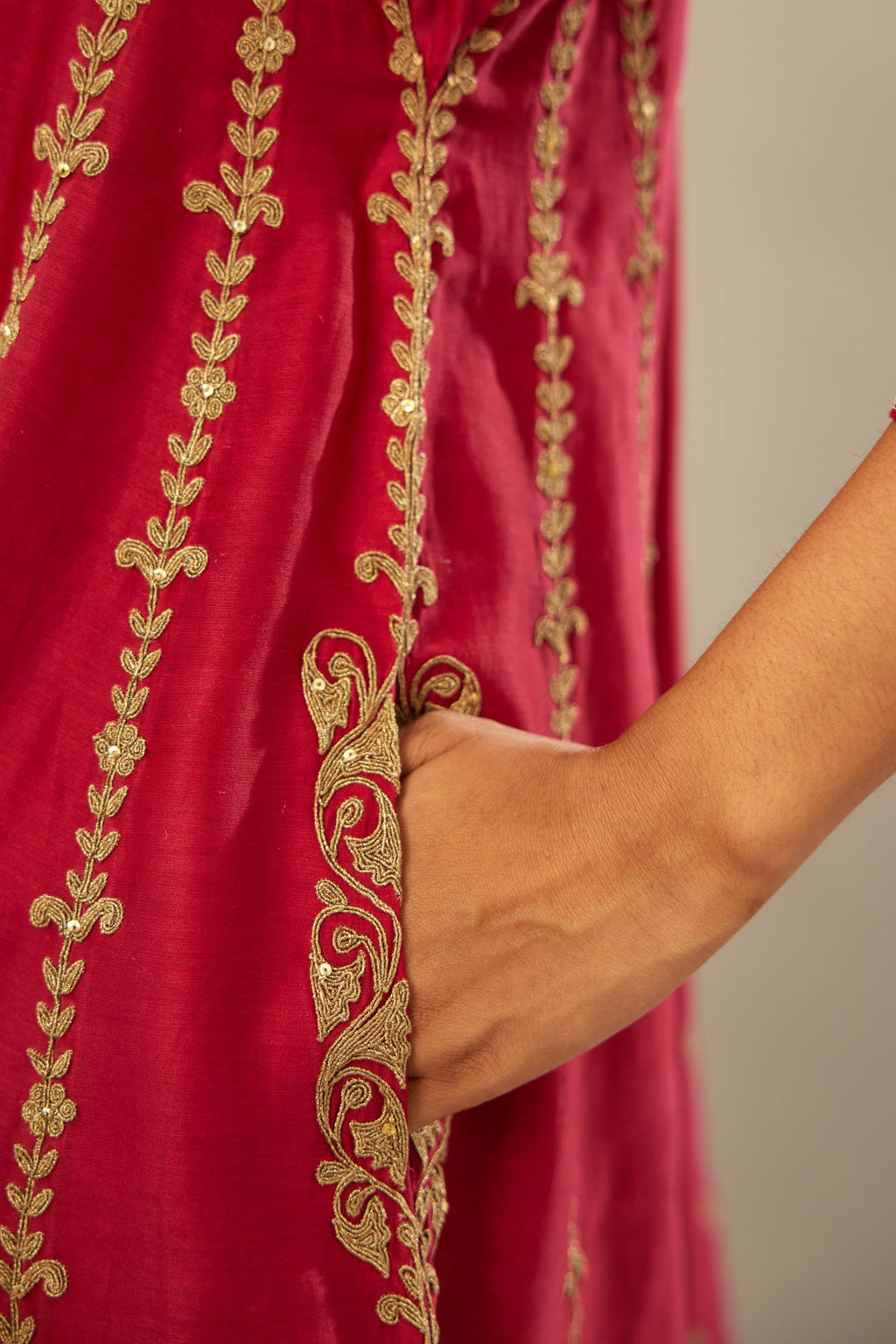 Fuchsia silk chanderi short kalidar kurta set with all-over delicate zari bootis, detailed with dori embroidery and gold sequin work.