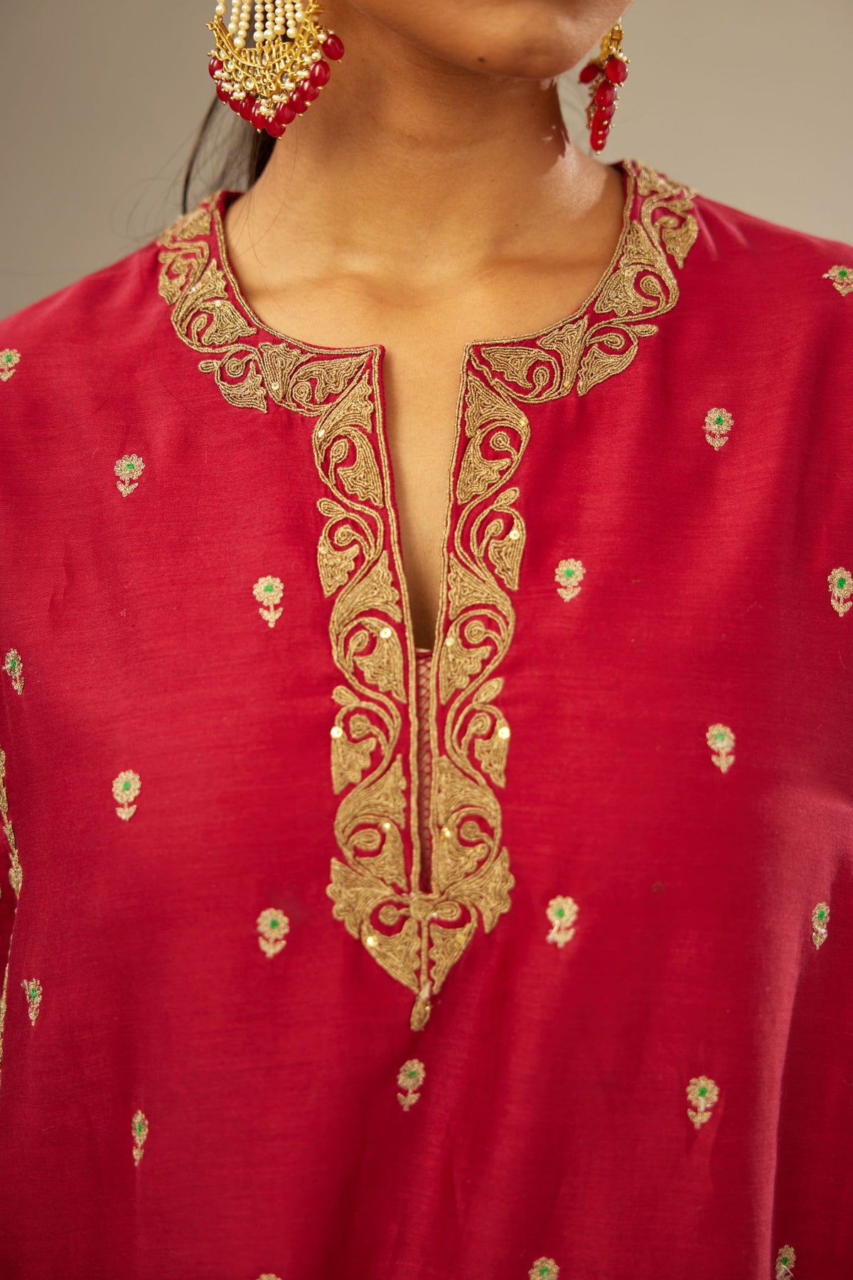Fuchsia silk chanderi short kalidar kurta set with all-over delicate zari bootis, detailed with dori embroidery and gold sequin work.