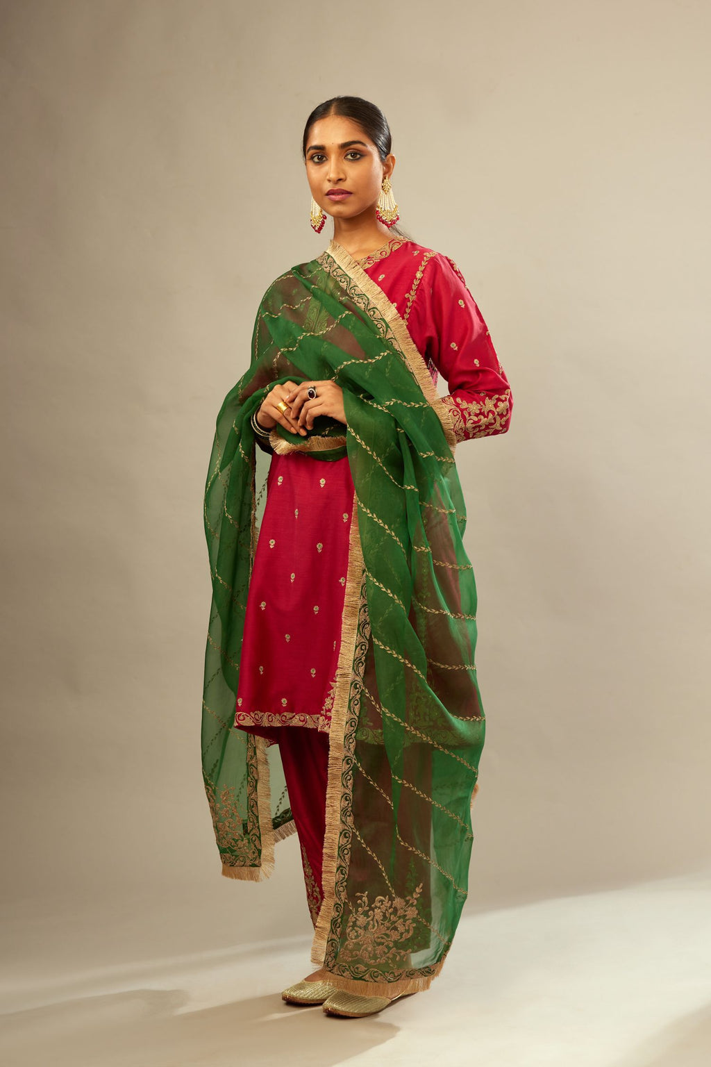 Fuchsia silk chanderi short kalidar kurta set with all-over delicate zari bootis, detailed with dori embroidery and gold sequin work.