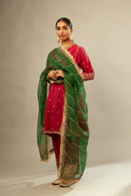 Fuchsia silk chanderi short kalidar kurta set with all-over delicate zari bootis, detailed with dori embroidery and gold sequin work.