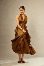 Golden olive silk long free size dress with asymmetric hem and side pockets, paired with navy blue silk velvet short jacket with light gold dori embroidery all-over the jacket.