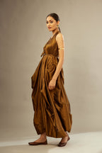 Golden olive silk long free size dress with asymmetric hem and side pockets, paired with navy blue silk velvet short jacket with light gold dori embroidery all-over the jacket.