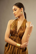 Golden olive silk long free size dress with asymmetric hem and side pockets, paired with navy blue silk velvet short jacket with light gold dori embroidery all-over the jacket.