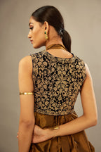 Golden olive silk long free size dress with asymmetric hem and side pockets, paired with navy blue silk velvet short jacket with light gold dori embroidery all-over the jacket.