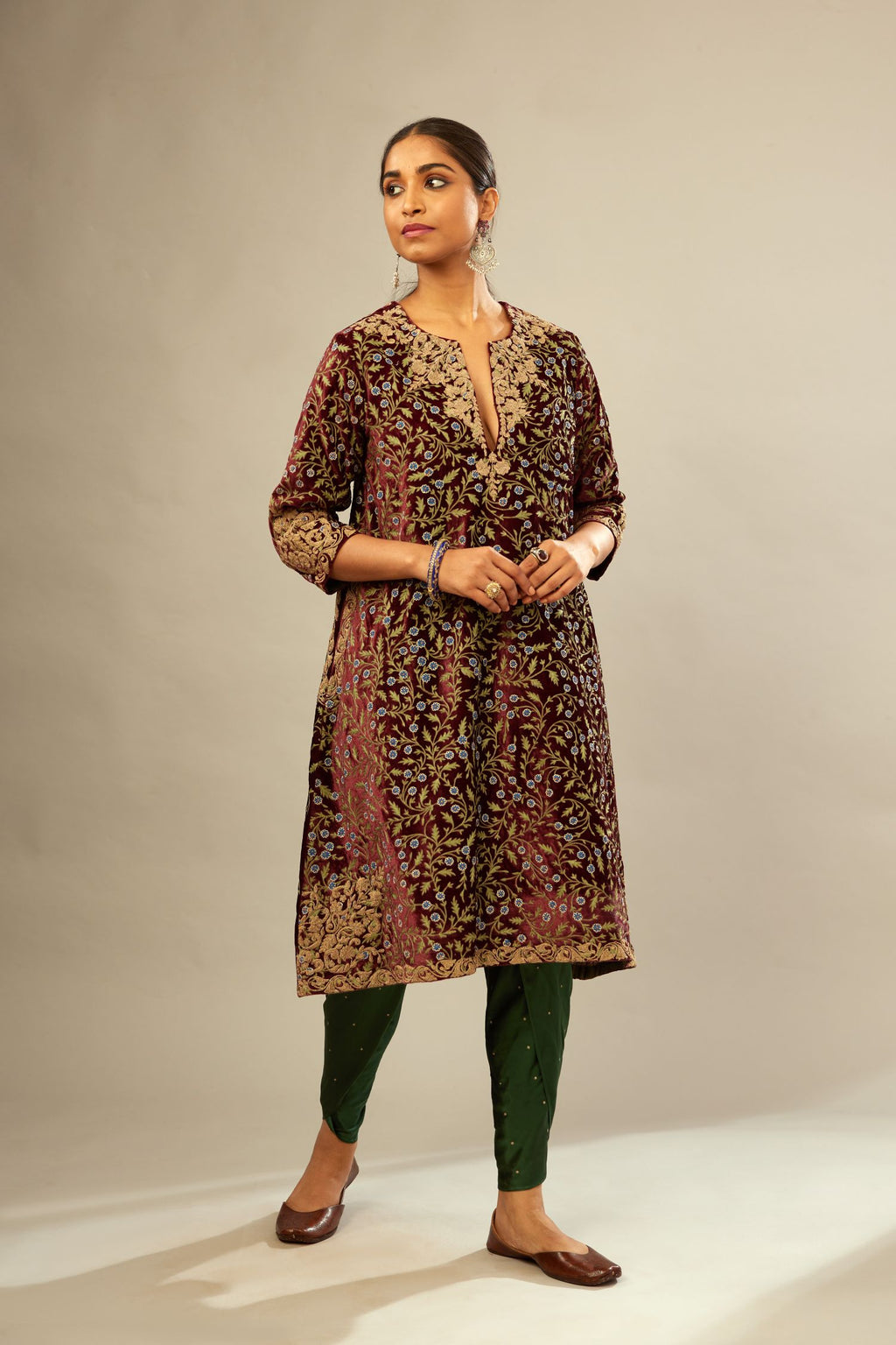 Maroon A-line silk velvet fully jaal embroidered kurta set, detailed with golden dori embroidery
